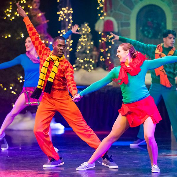 two dancers in christmas attire